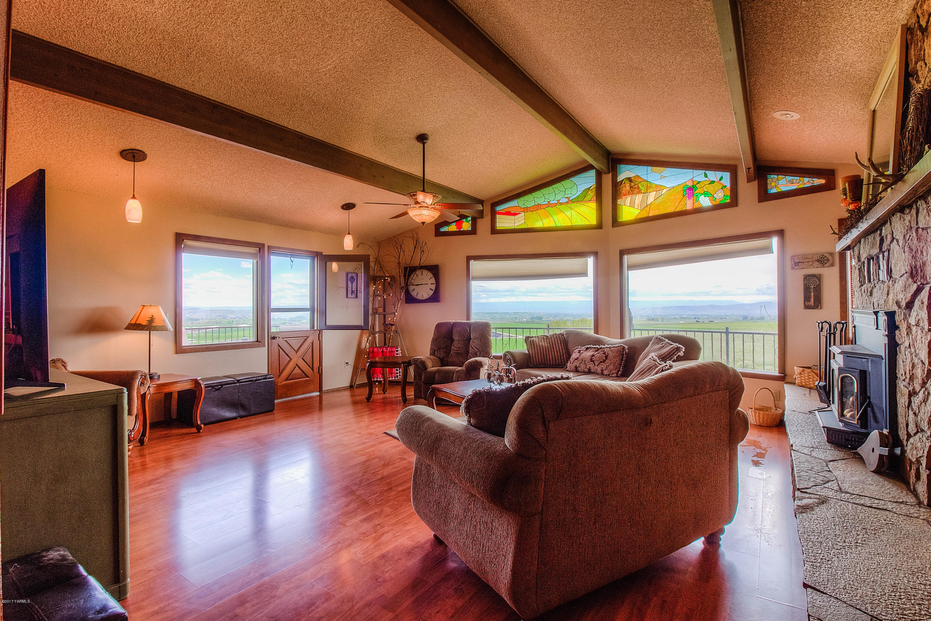 600 Cornue Road Zillah, WA 98953 - Photo 3 of 33 a living room with fireplace furniture and a large window
