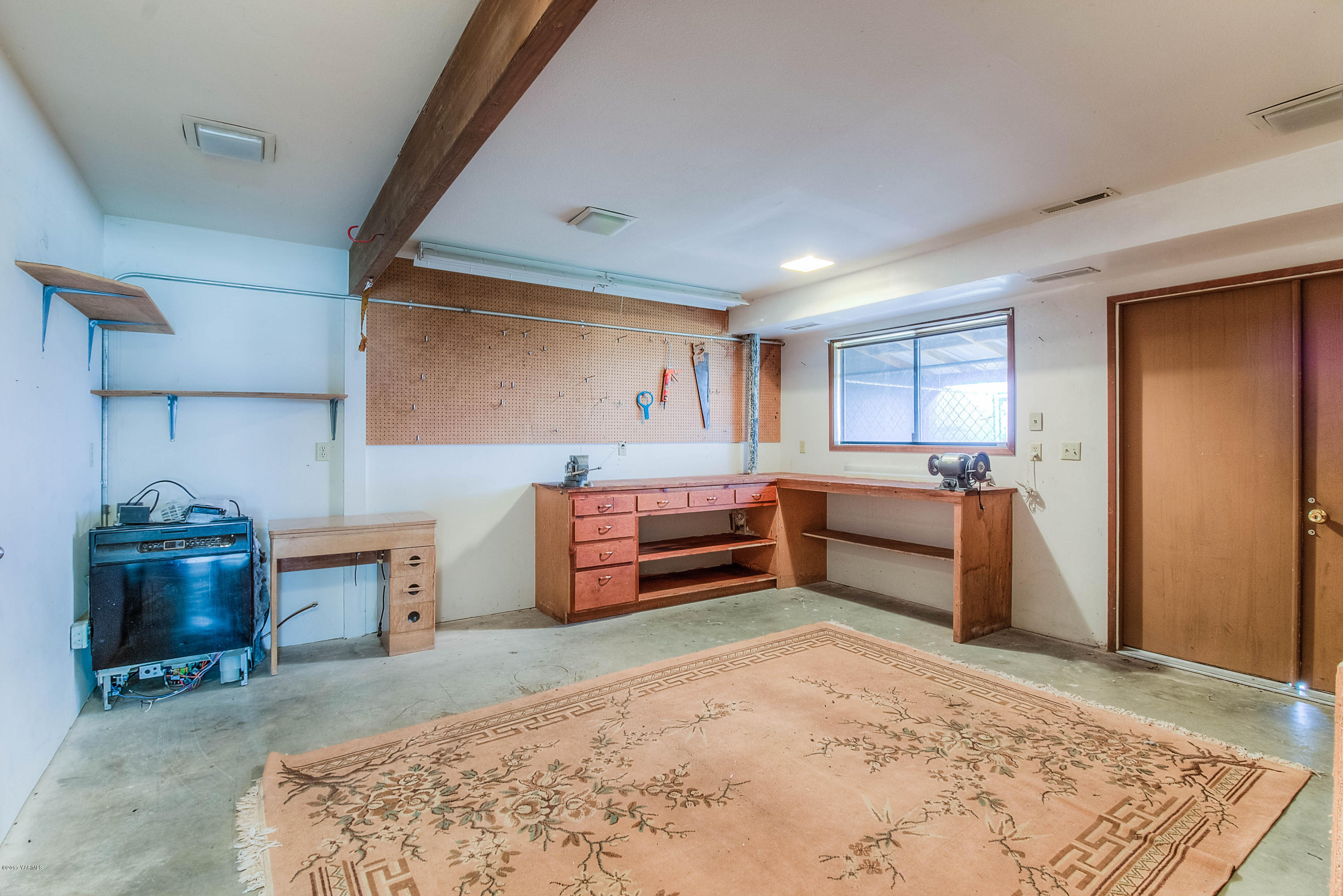 600 Cornue Road Zillah, WA 98953 - Photo 25 of 33 a bedroom with furniture and a fireplace