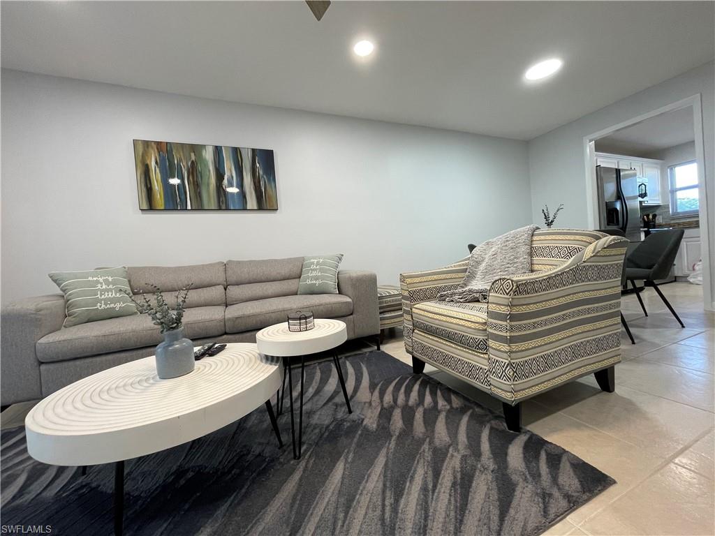 170 Turtle Lake Court, Unit 103 Naples, FL 34105 - Photo 4 of 37 Living area featuring recessed lighting and light tile patterned floors