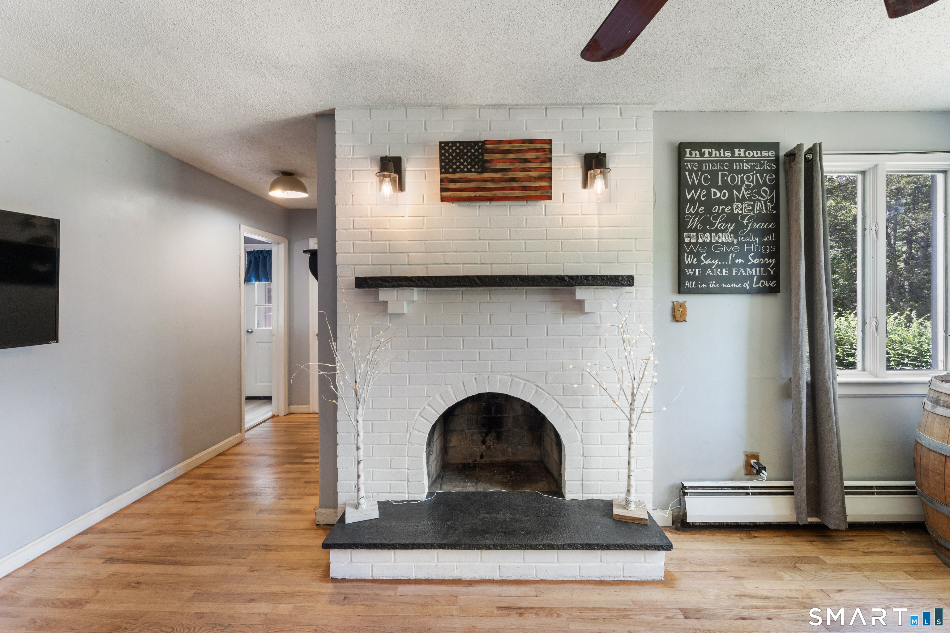 273 Hartford Road Brooklyn, CT 06234 - Photo 3 of 24 A wood-burning fireplace brings warmth, character and farmhouse charm to the heart of the home.