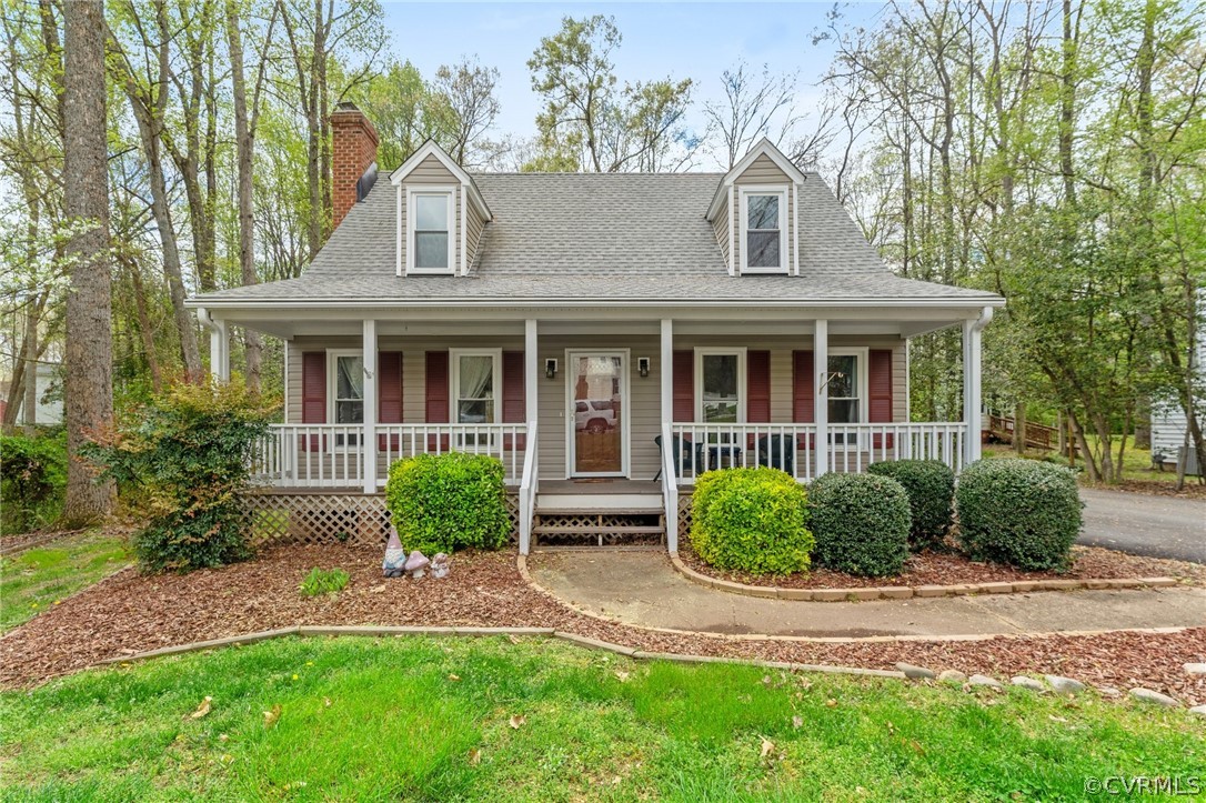 front view of brick house with a yard