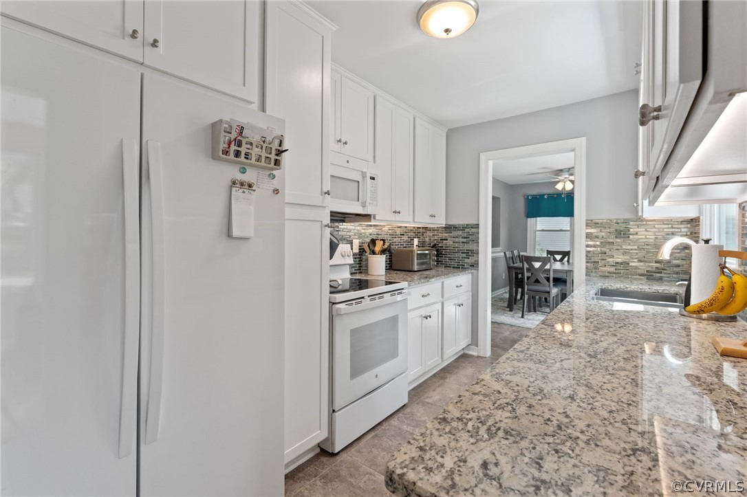 7106 Deer Thicket Drive Midlothian, VA 23112 - Photo 12 of 34 a kitchen with a refrigerator and a sink