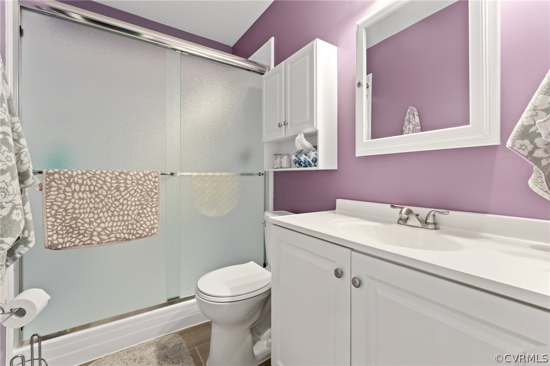 7106 Deer Thicket Drive Midlothian, VA 23112 - Photo 19 of 34 a bathroom with a sink mirror vanity and toilet
