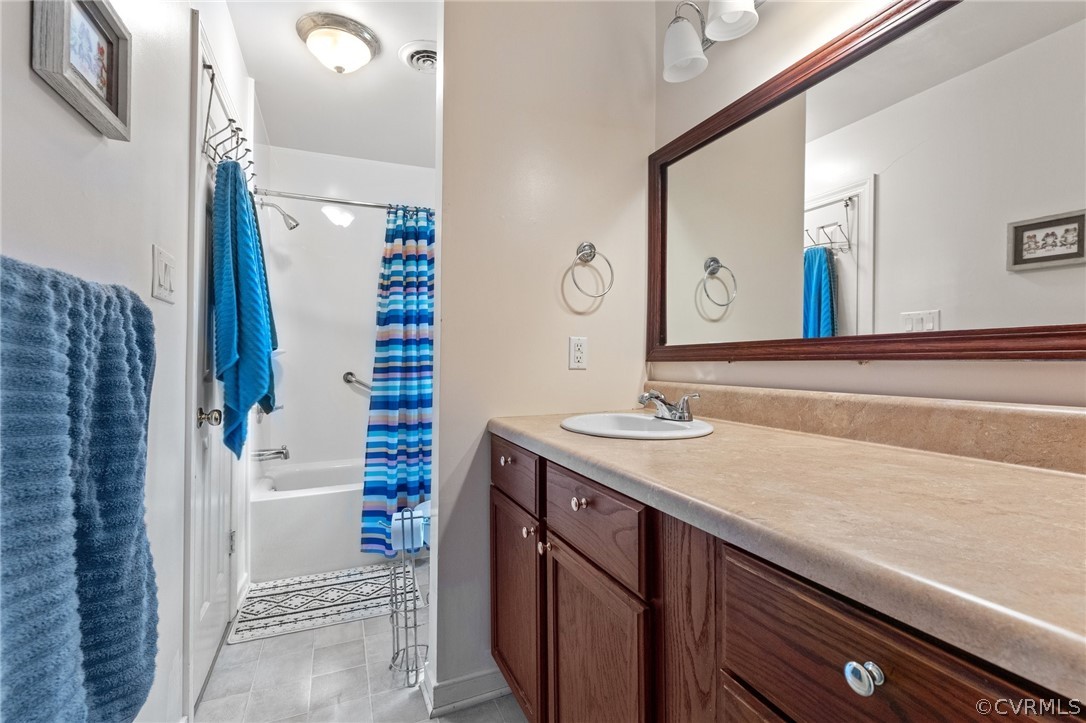 7106 Deer Thicket Drive Midlothian, VA 23112 - Photo 26 of 34 a bathroom with a sink and a mirror