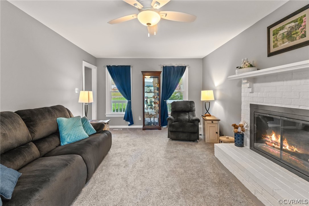 7106 Deer Thicket Drive Midlothian, VA 23112 - Photo 5 of 34 a living room with furniture and a fireplace