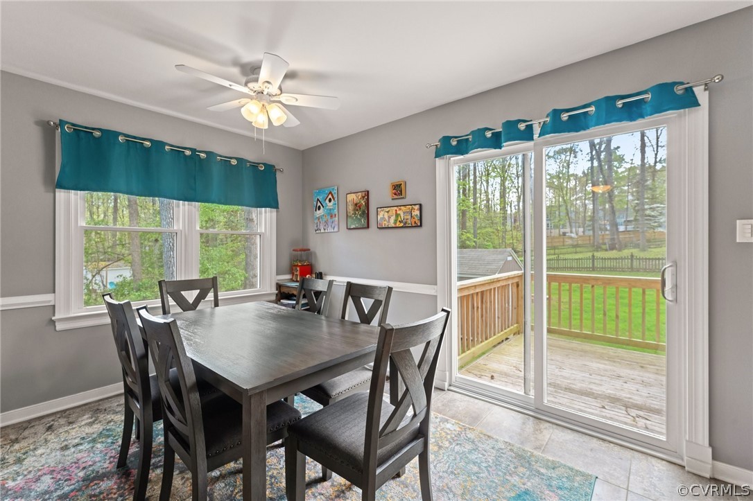 7106 Deer Thicket Drive Midlothian, VA 23112 - Photo 6 of 34 a view of a dining room with furniture large windows and wooden floor