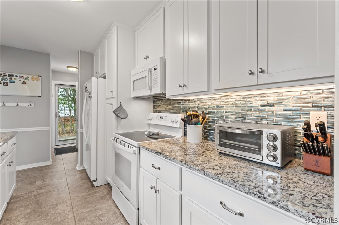 7106 Deer Thicket Drive Midlothian, VA 23112 - Photo 9 of 34 a kitchen with granite countertop a sink and cabinets