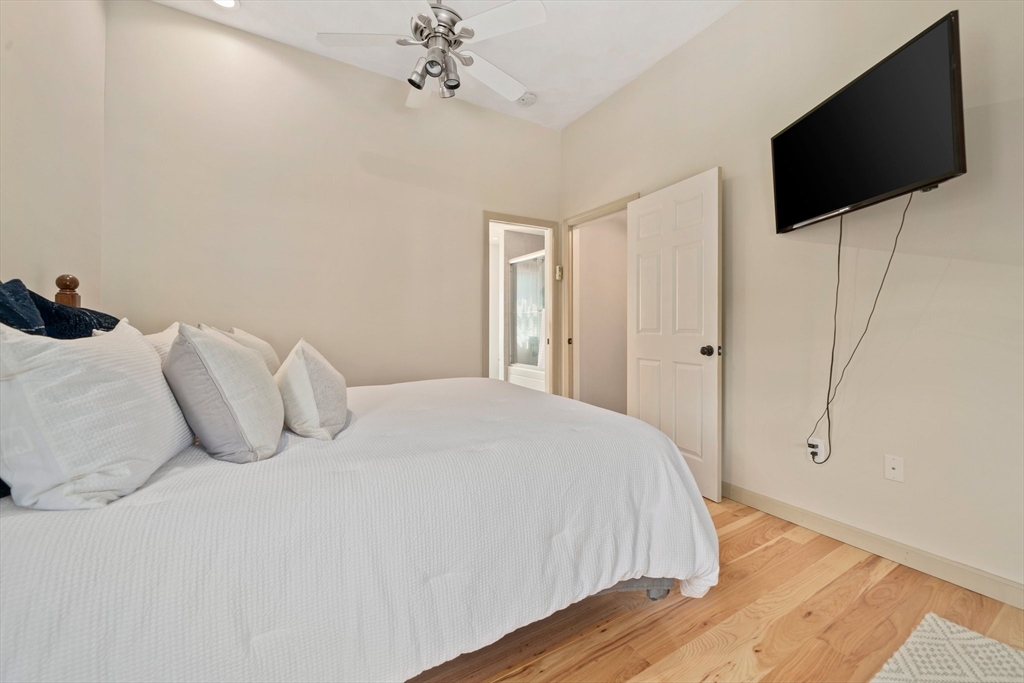 5 Kingsbury Road Canton, MA 02021 - Photo 15 of 39 a bedroom with a bed and a flat screen tv