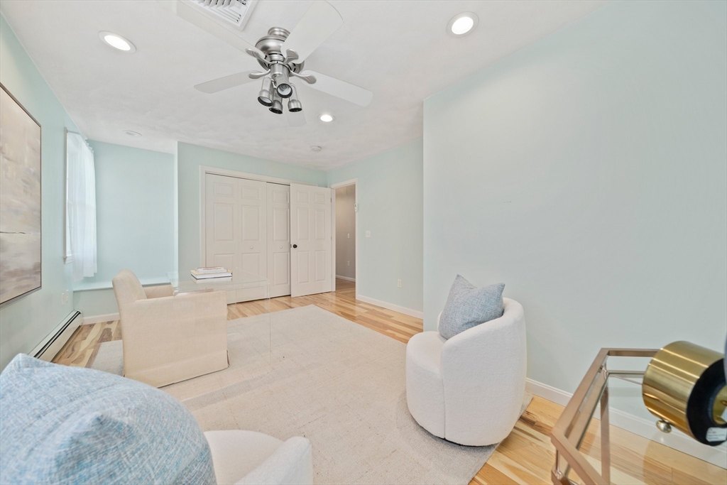 5 Kingsbury Road Canton, MA 02021 - Photo 18 of 39 a spacious bedroom with a bed and a chandelier