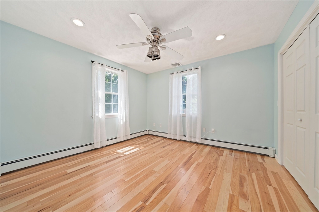 5 Kingsbury Road Canton, MA 02021 - Photo 20 of 39 an empty room with wooden floor fan and windows