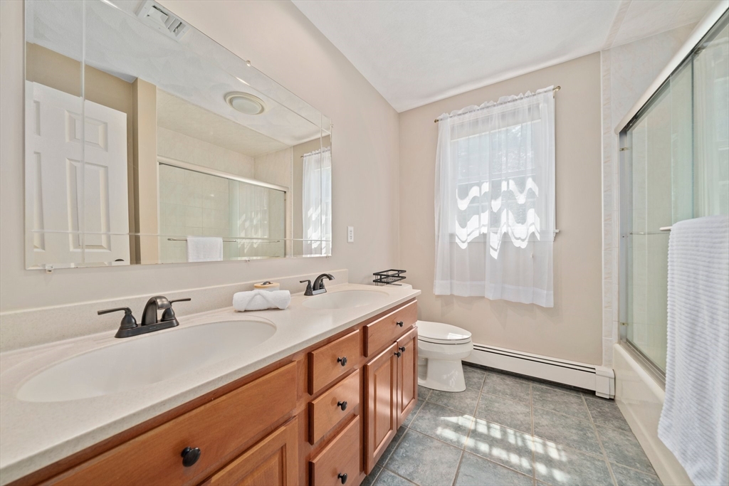5 Kingsbury Road Canton, MA 02021 - Photo 22 of 39 a bathroom with a double vanity sink toilet mirror and bathtub