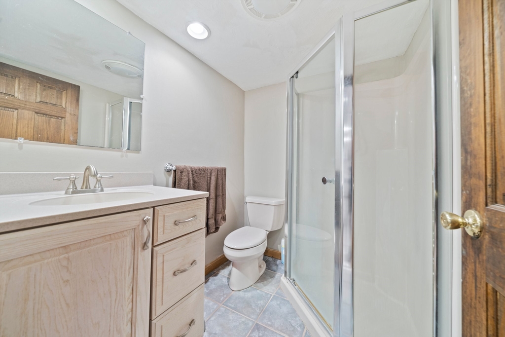 5 Kingsbury Road Canton, MA 02021 - Photo 25 of 39 a bathroom with a toilet sink and mirror