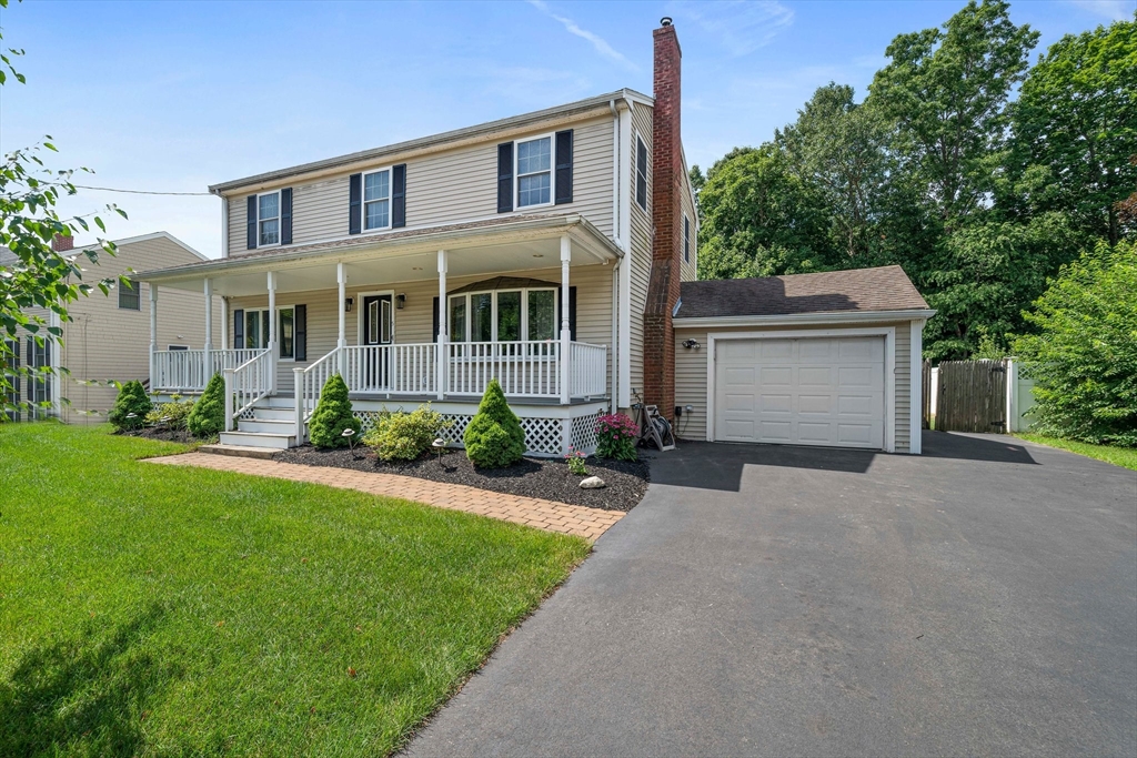 5 Kingsbury Road Canton, MA 02021 - Photo 3 of 39 a front view of a house with a yard and garage