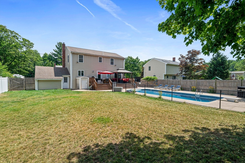5 Kingsbury Road Canton, MA 02021 - Photo 31 of 39 a view of a house with backyard and sitting area