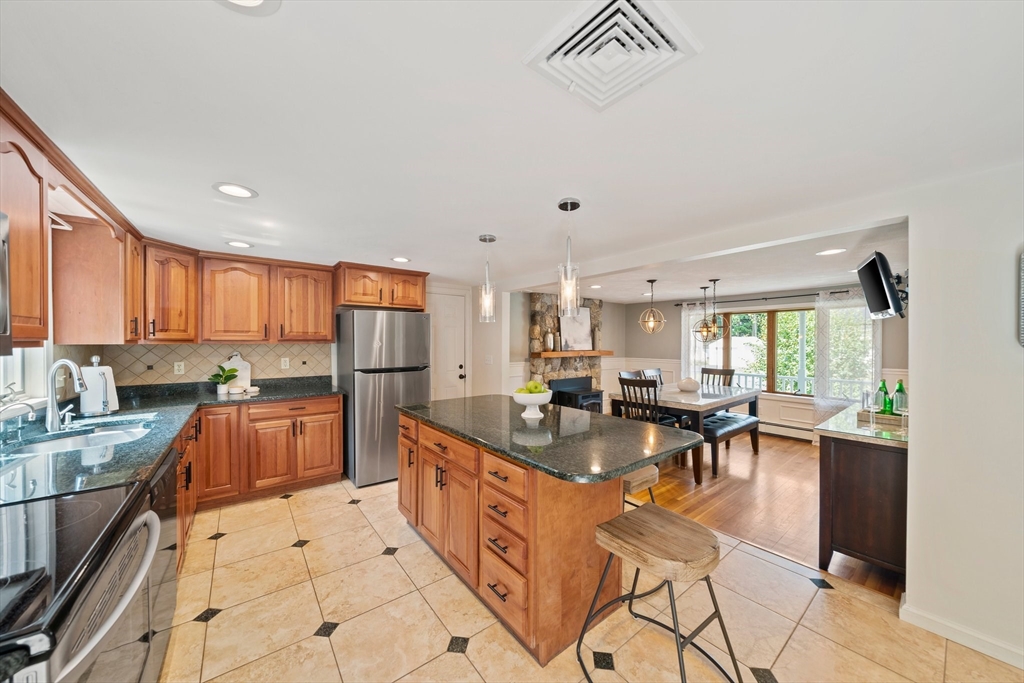 5 Kingsbury Road Canton, MA 02021 - Photo 6 of 39 a large kitchen with lots of counter top space and stainless steel appliances