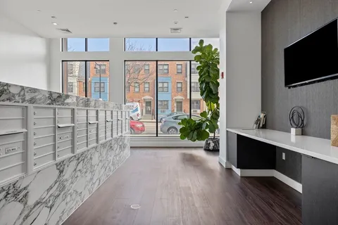 a view of entryway with wooden floor