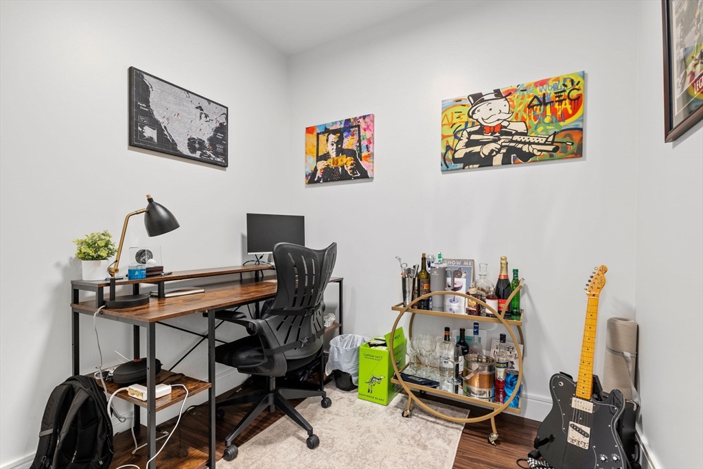 99 Sumner Street, Unit 101 Boston, MA 02128 - Photo 10 of 35 a view of a workspace with furniture
