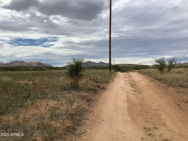 a view of a lake with beach in background