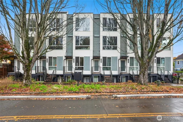 a front view of a building with a garden