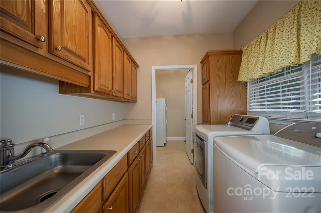259 Bent Tree Drive Rutherfordton, NC 28139 - Photo 24 of 48 a kitchen with stainless steel appliances granite countertop a sink and a stove
