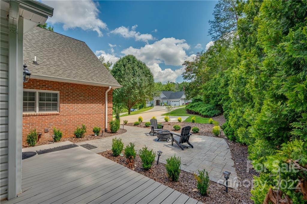 259 Bent Tree Drive Rutherfordton, NC 28139 - Photo 46 of 48 a view of a patio with table and chairs with wooden fence