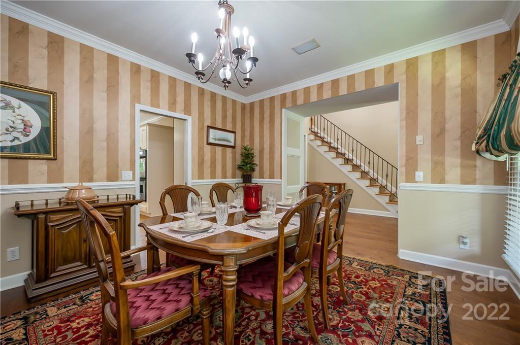 259 Bent Tree Drive Rutherfordton, NC 28139 - Photo 6 of 48 a view of a dining room with furniture and a chandelier