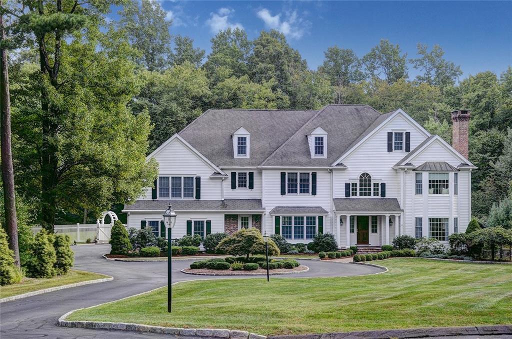 6 Eustis Lane Ridgefield, CT 06877 - Photo 1 of 1 a front view of a house with a garden