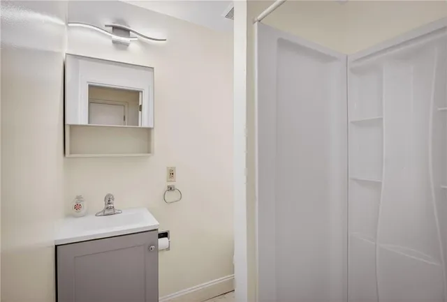 a bathroom with a sink and mirror