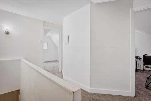 a bathroom with a shower and a sink