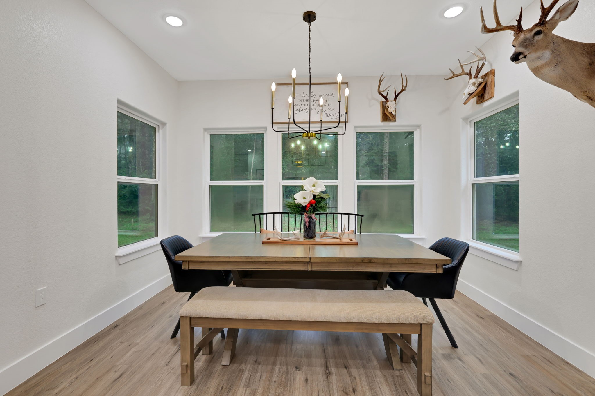 60 V Allen Lane Coldspring, TX 77331 - Photo 11 of 27 a view of a dining room with furniture window and wooden floor