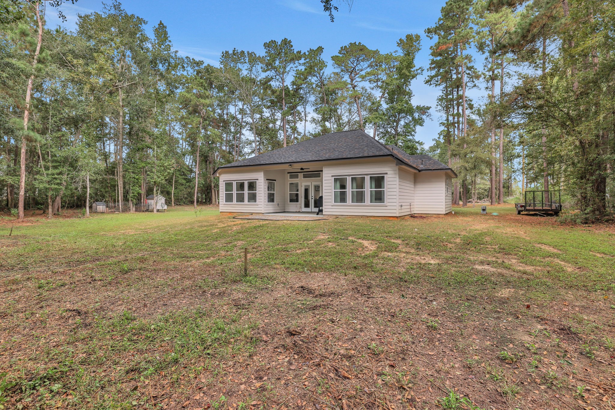 60 V Allen Lane Coldspring, TX 77331 - Photo 22 of 27 a view of a house with a yard