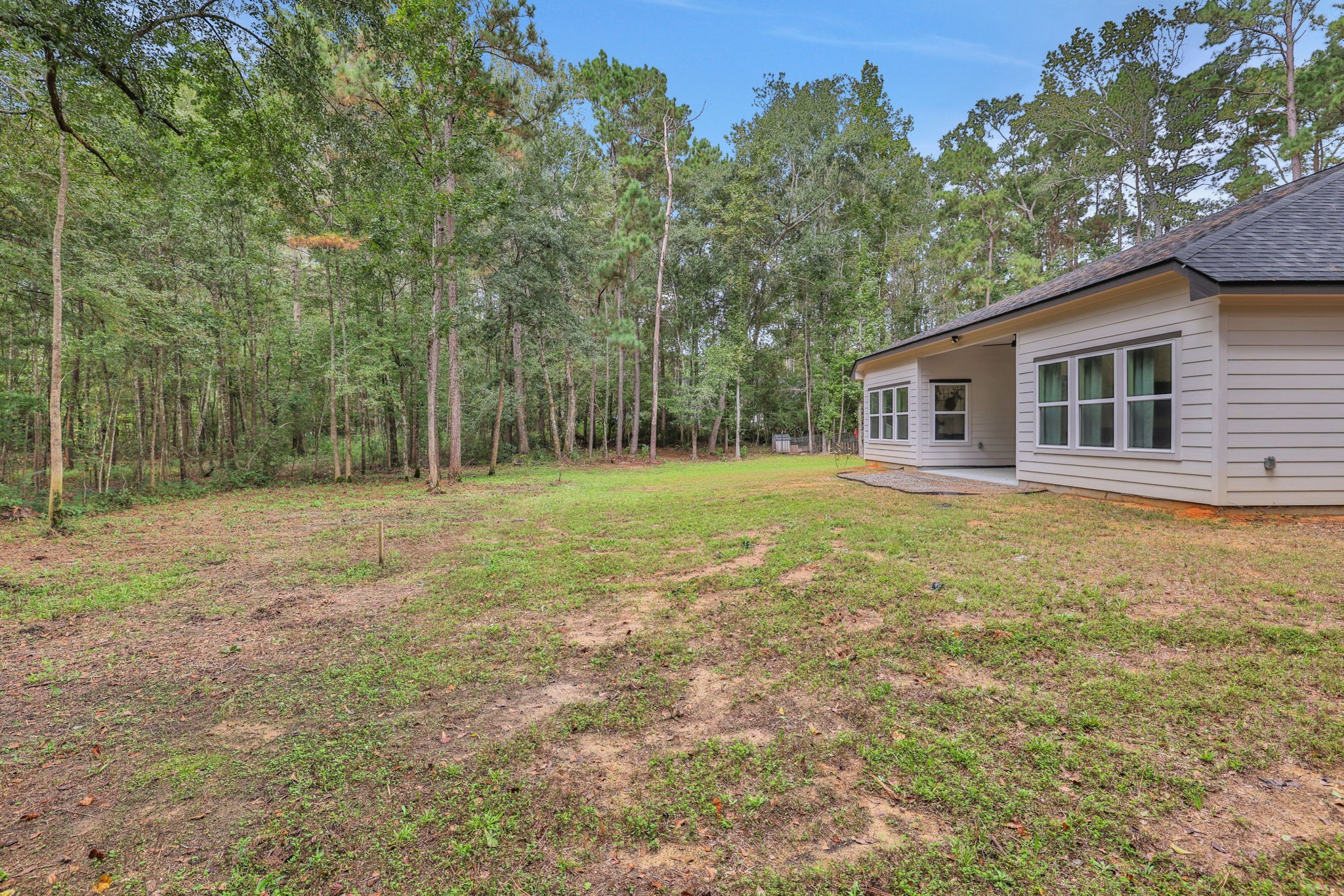 60 V Allen Lane Coldspring, TX 77331 - Photo 23 of 27 a house view with swimming pool in front of it
