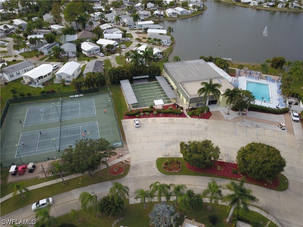10849 Barred Owl Circle, Unit 25 Estero, FL 33928 - Photo 24 of 24 an aerial view of a house with a yard basket ball court and outdoor seating