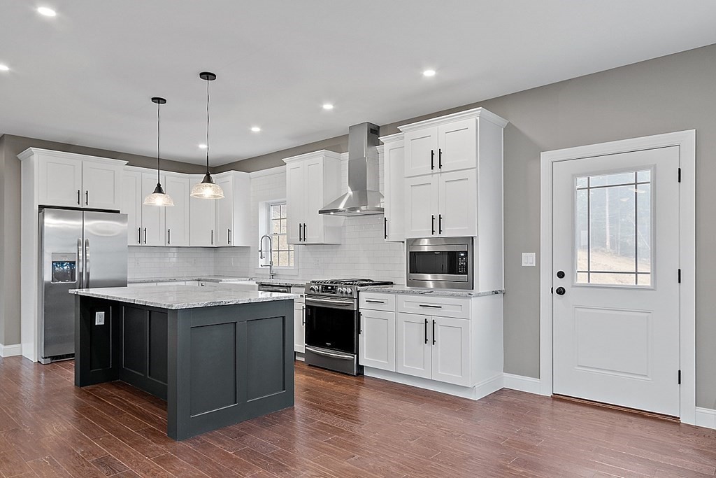 1435 South Athol Road Athol, MA 01331 - Photo 11 of 23 a kitchen with stainless steel appliances granite countertop a stove a sink and a refrigerator