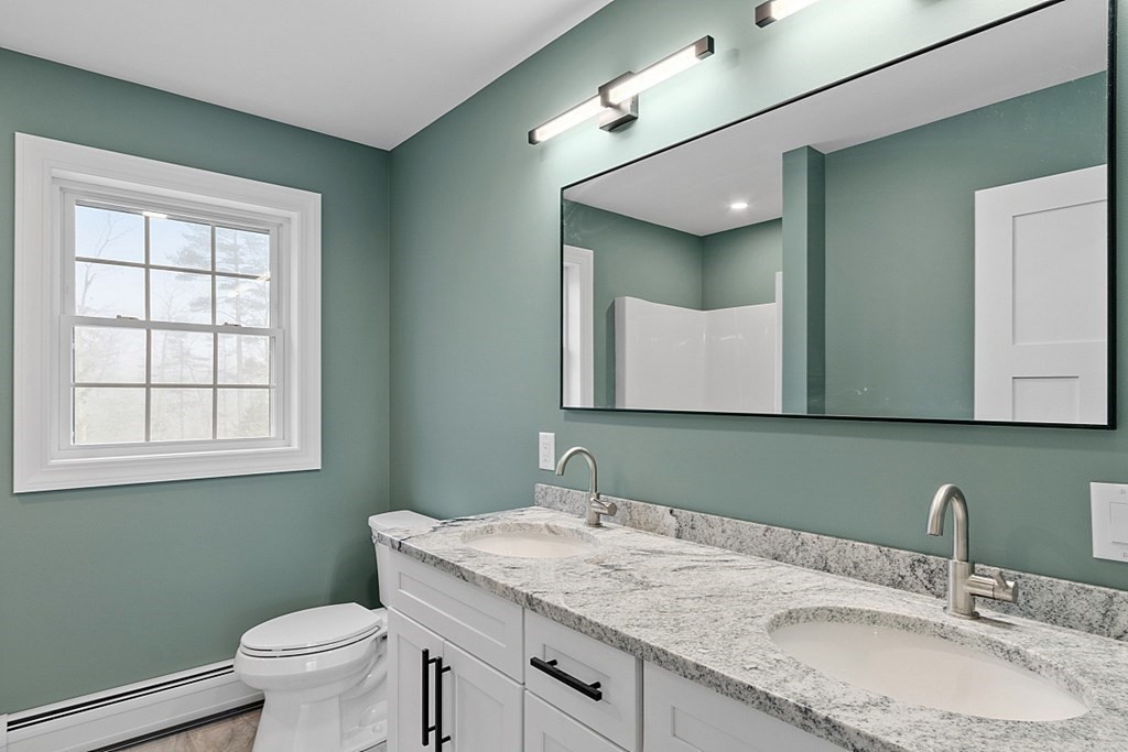 1435 South Athol Road Athol, MA 01331 - Photo 19 of 23 a bathroom with a granite countertop sink a mirror and a toilet