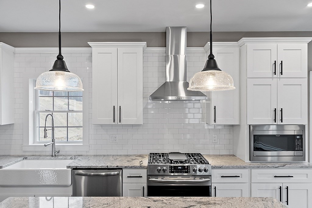 1435 South Athol Road Athol, MA 01331 - Photo 8 of 23 a kitchen with stainless steel appliances a stove a sink and a wooden floor