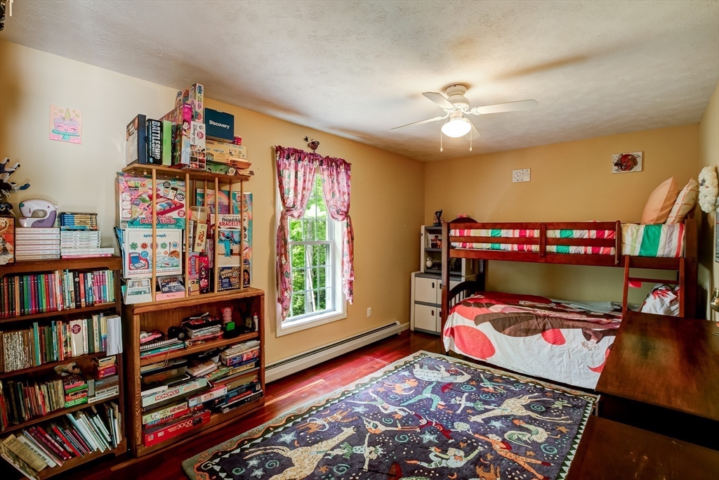 6 Loon Road Winchendon, MA 01475 - Photo 26 of 36 a bedroom with furniture and a book shelf