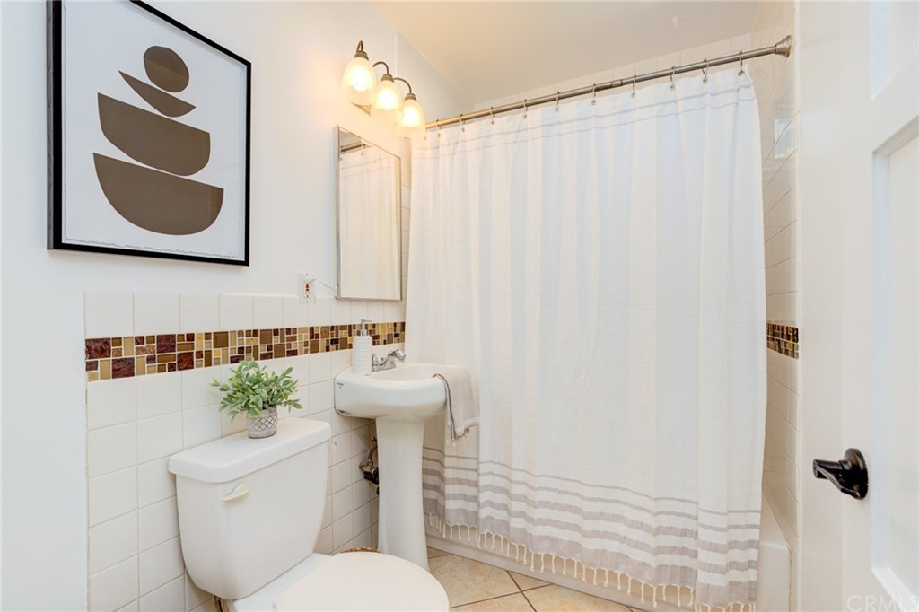 8218 Handley Avenue Los Angeles, CA 90045 - Photo 16 of 20 a bathroom with a toilet sink and mirror