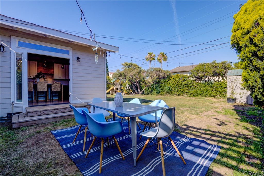 8218 Handley Avenue Los Angeles, CA 90045 - Photo 17 of 20 a view of a patio with table and chairs and potted plants