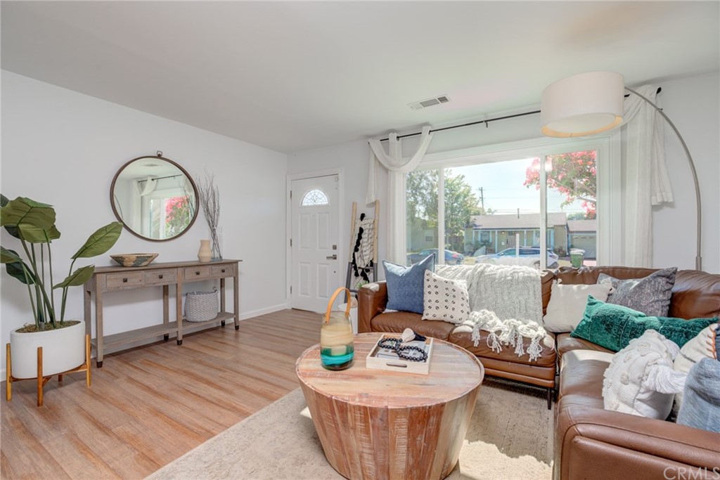 8218 Handley Avenue Los Angeles, CA 90045 - Photo 5 of 20 a living room with furniture a fireplace and a large window