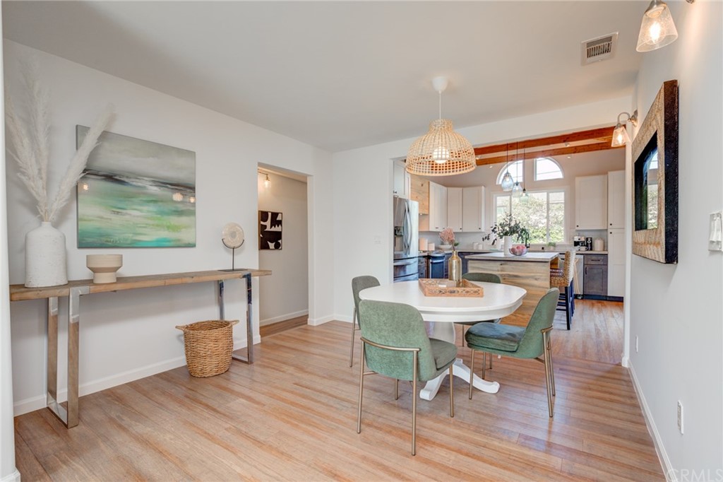 8218 Handley Avenue Los Angeles, CA 90045 - Photo 6 of 20 a view of a dining room with furniture and wooden floor
