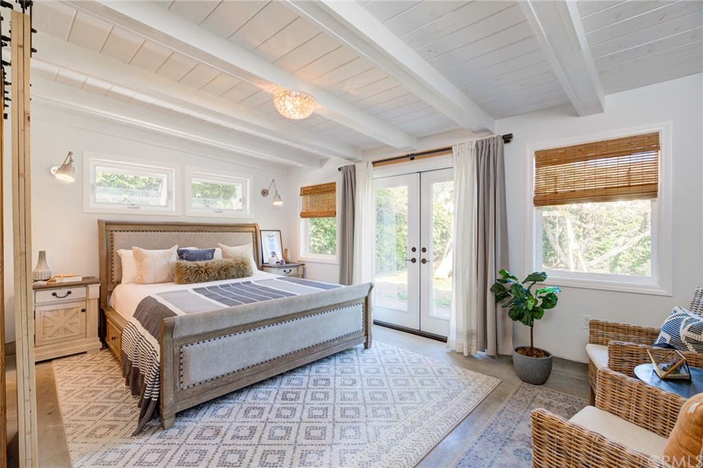 8218 Handley Avenue Los Angeles, CA 90045 - Photo 7 of 20 a bedroom with a large bed and a couch