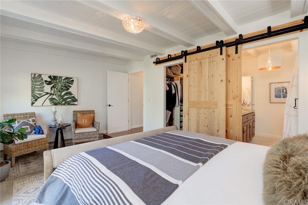 8218 Handley Avenue Los Angeles, CA 90045 - Photo 8 of 20 a bedroom with a large bed and a window