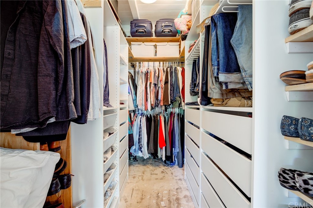 8218 Handley Avenue Los Angeles, CA 90045 - Photo 10 of 20 a view of walk in closet with clothes and shoes
