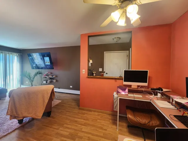 a workspace with furniture and wooden floor