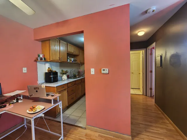a kitchen with stainless steel appliances a sink a stove and cabinets