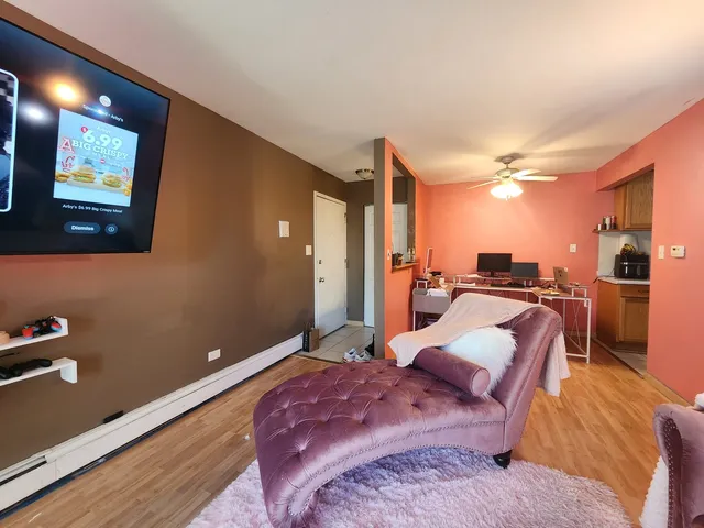 a bedroom with two beds and a lamp