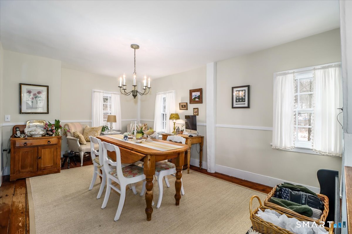 3 Gelston Road Sherman, CT 06784 - Photo 11 of 36 a view of a dining room with furniture window and wooden floor