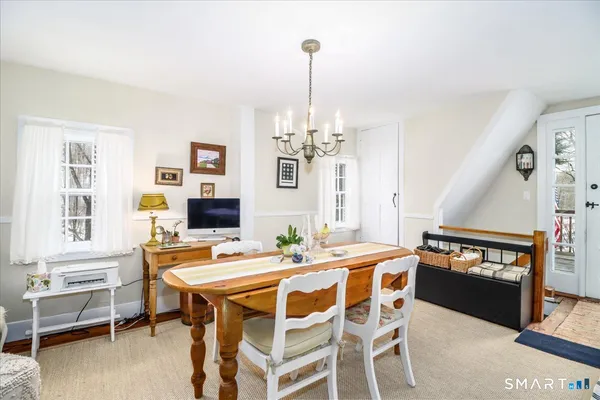 a dining room with furniture and window
