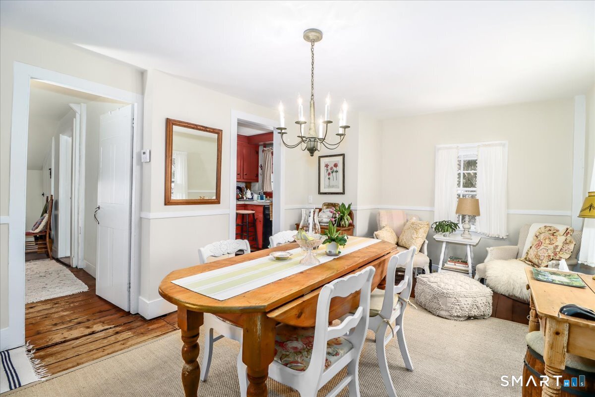 3 Gelston Road Sherman, CT 06784 - Photo 13 of 36 a dining room with furniture a chandelier and wooden floor